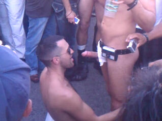 Homo fellate shaft in the crowd of onlookers